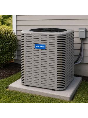 MRCOOL Signature  heat pump condenser installed on a condsenser pad next to a home