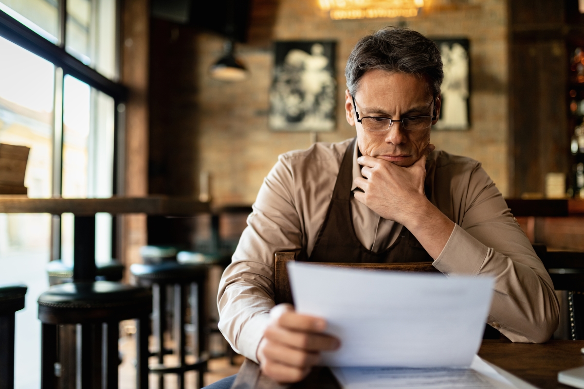 Image of man studying commercial hvac quotes